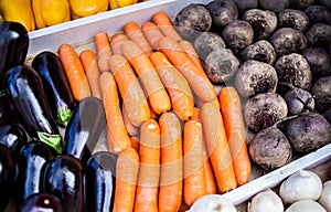 Assortment of fresh vegetables at market counter, vegetable shop, farmer marketplace. Organic, healthy, vegetarian diet food