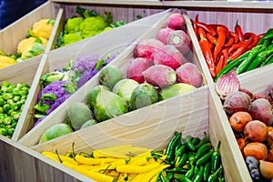 Assortment of fresh vegetables at market counter, vegetable shop, farmer marketplace. Organic, healthy, vegetarian diet food conce