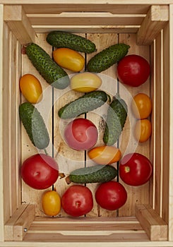 Assortment of fresh vegetables in a wooden box