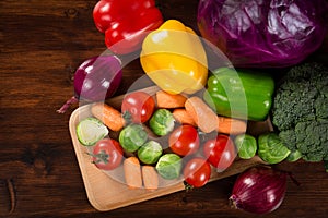 Assortment of fresh vegetales on table with copyspace photo