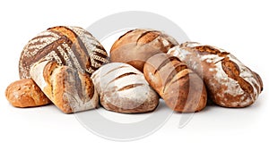 An assortment of freshly baked bread loaves with various crusts and patterns, arranged on a white surface