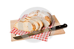 Assortment of freshly sliced baked bread with napkin isolated on white background. Healthy unleavened bread. French