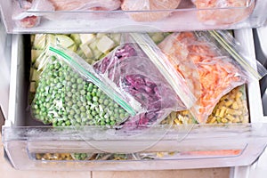 Assortment of frozen Vegetables in fridge. Frozen food in the freezer