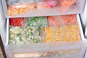 Assortment of frozenVegetables in home fridge. Frozen food