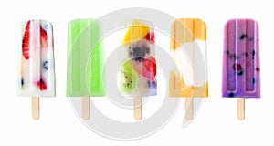 Assortment of fruit summer popsicles isolated on white