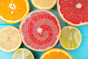 Assortment of halved fresh citrus fruit