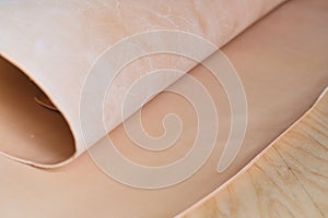 assortment of high-quality natural beige leather samples, emphasizing the importance of material selection in