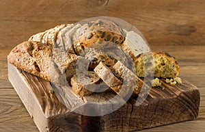 Assortment of Homemade Gluten-free vegan bread on the rustic wooden table. Homemade baked pastry