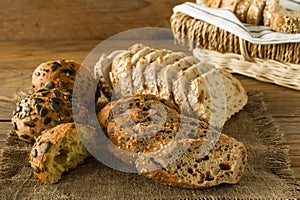 Assortment of Homemade Gluten-free vegan bread on the rustic wooden table. Homemade baked pastry
