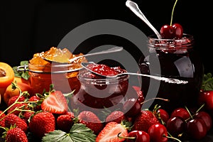 Assortment of jams, seasonal berries, apricot, mint and fruits. marmalade or confiture