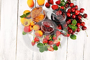 Assortment of jams, seasonal berries, apricot, mint and fruits. marmalade or confiture