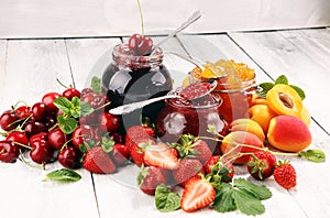 Assortment of jams, seasonal berries, apricot, mint and fruits. marmalade or confiture