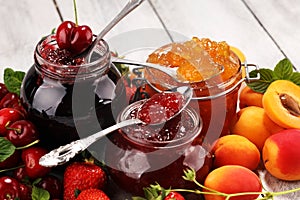 Assortment of jams, seasonal berries, apricot, mint and fruits. marmalade or confiture