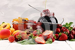 Assortment of jams, seasonal berries, apricot, mint and fruits. marmalade or confiture