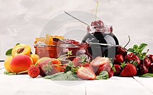 Assortment of jams, seasonal berries, apricot, mint and fruits. marmalade or confiture