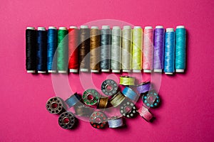 Assortment of multicolor threads in bobbins and spools