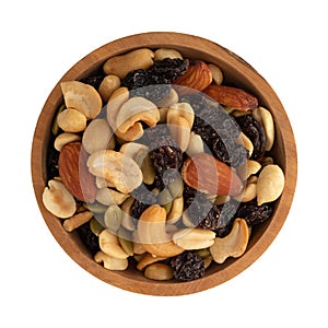 Assortment of nuts and dried fruit in a wood bowl isolated on a white background top view