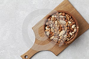 Assortment of nuts in wooden bowl. Almonds, cashews,  hazelnuts, walnuts and pistachios. Top view.