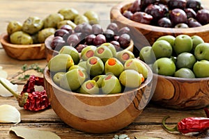 Assortment of olives in wooden bowl