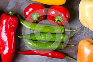 Assortment of peppers on the grey table