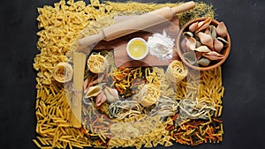 Assortment of  raw pasta. Different kinds of macaroni  tagliatelle farfalle spaghetti penne rigate