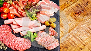 Assortment of salami prosciutto meats and sausages, olives and spices.Meat appetizer.Different types of sausages with