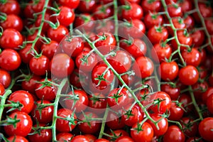 Assortment of small cherry tomatoes on market. Organic fresh veg