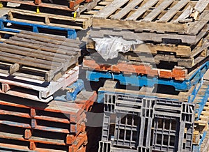 Assortment of Stacked Pallets Outside