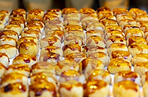 Assortment of sweet golden toasted burnt sugar panellet cookies on a tray fresh from the gourmet artisan oven. Pastries, cakes and photo