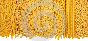 Assortment of uncooked italian pasta on a white