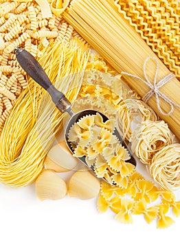 Assortment of uncooked pasta on white