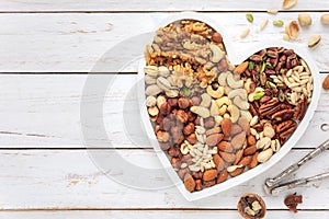 Assortment of various nuts in a heart shaped plate