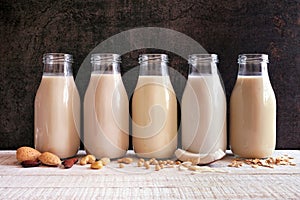 Assortment of vegan, plant based, non dairy milks in bottles