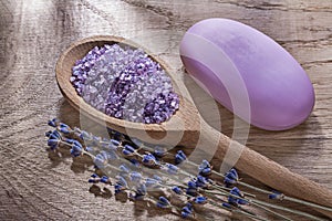 Assortment of wooden spoon crystal sea salt dry lavender bar soap on wood board healthcare concept