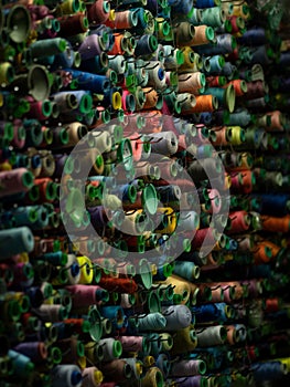 Assortment of woolen threads arranged in a vibrant pattern