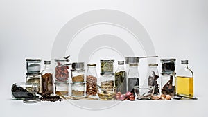 Assortments of spices. Row of spice jars assorted and herb seeds in jars on white background. differnt seeds and food spices in