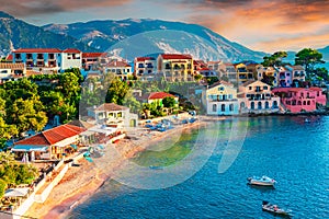 Assos, Kefalonia, Greece. Colorful houses and turquoise colored bay of a village on an idyllic Ionian island