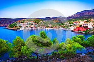 Assos, Kefalonia, Greece. Colorful houses and turquoise colored bay of a village on an idyllic Ionian island