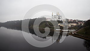 Assumption Cathedral in Vitebsk in fog photo