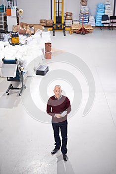 Assuring quality on the shop floor. Portrait of a factory manager using a digital tablet during an inspection.