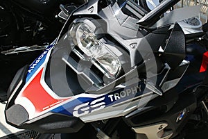Assymetrical headlights, front mudguard and windshield on dual sport german motorcycle BMW 1250 GS.