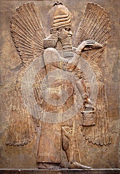 Assyrian wall relief of a winged genius