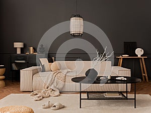 Asthetic composition of living room interior with modular sofa, black coffee table, white armchair, carpet, pouf, dark wall and