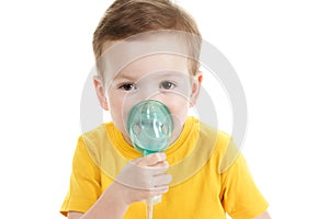 Asthma patient, children boy diagnosis asthma inhalation therapy the mask of inhaler. Close up a little kid with respiratory disea