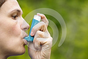 Asthma patient inhaling medication photo