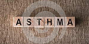 Asthma Spelled With Wooden Blocks on a Carpet