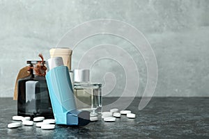 Asthma treatment accessories on black smokey table