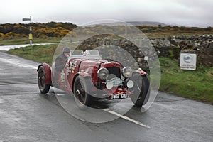 A 1934 Aston Martin Ulster Leaves Caldbeck, Cumbria in the Flying Scotsman Rally photo