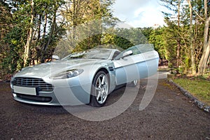 An Aston Martin Vantage English Grand Tourer with door open