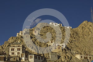 Astone houses of the Tibetans on the surface of a desert mountain